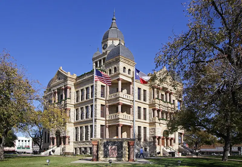 The Denton County, Texas courthouse located at  33.2151° -97.1331°, Denton, Texas, United States. The Romanesque style structure was added to the National Register of Historic Places in 1977.
